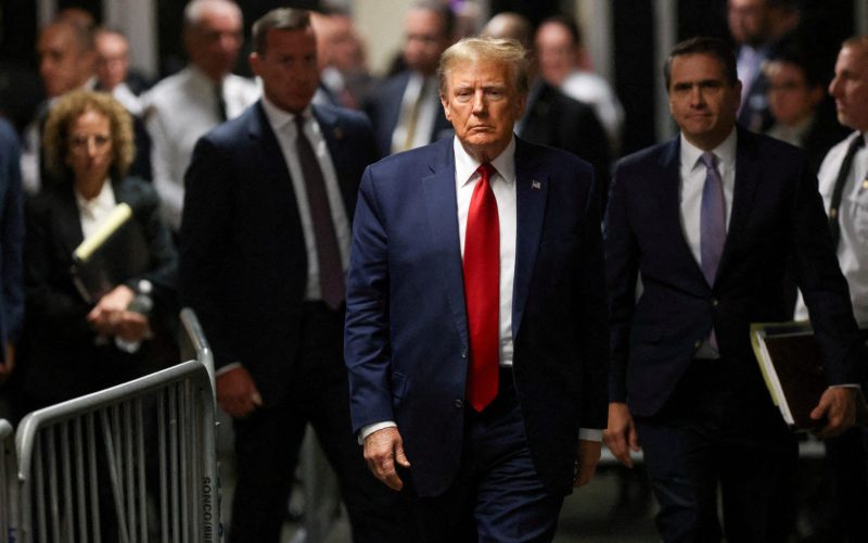 FILE PHOTO: Former U.S. President Donald Trump walks outside the courtroom on the day of a court hearing on charges of falsifying business records to cover up a hush money payment to a porn star before the 2016 election, in New York State Supreme Court in the Manhattan borough of New York City, U.S., February 15, 2024. REUTERS/Andrew Kelly/File Photo